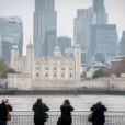 Editorial photograph from the south bank of the River Thames in London, looking toward a medieval.