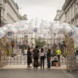 Editorial photograph on the pedestrianised Strand in London during London Design Festival: a temporary bamboo-grid pavilion.