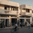 Editorial photograph of a lived-in modernist streetscape in Asmara, Eritrea, on its high plateau above 2,300.