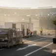 Editorial photographic concept at an outdoor concert ground in Madrid the morning after a stadium-scale show.
