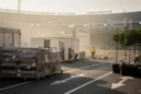 Editorial photographic concept at an outdoor concert ground in Madrid the morning after a stadium-scale show.