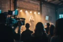 Editorial photograph of an intimate live music performance in a contemporary venue within a converted industrial.