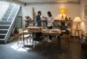 Illustrative editorial photograph evoking the London Design Festival: a modest basement retail gallery staged as.