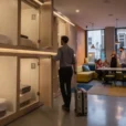 Illustrative editorial photograph inside a capsule hotel in Soho, central London, showing the threshold between.